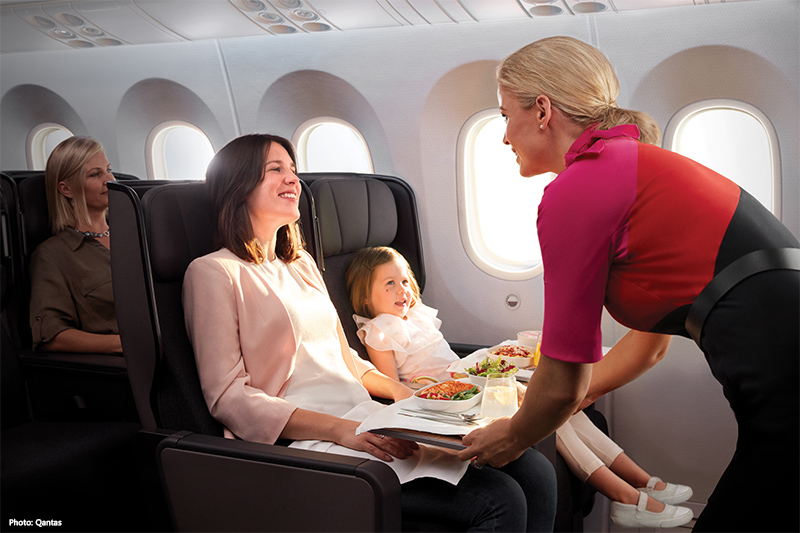 Woman and child on Qantas Premium Economy service